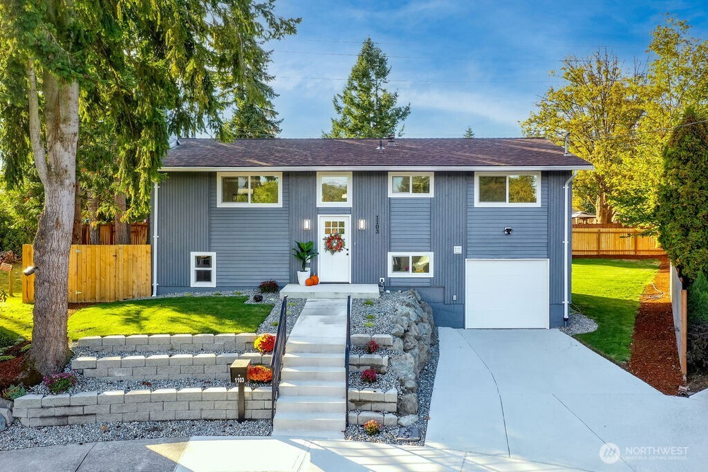 1103 Vashon Court Northeast Renton, WA 98059 - Photo 2 of 26 a view of a house with a swimming pool