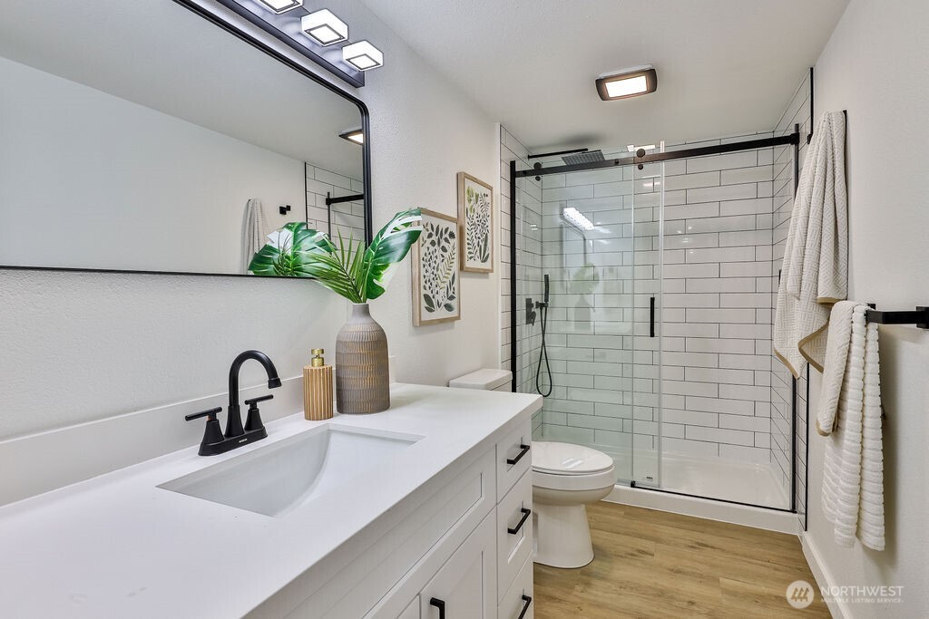 1103 Vashon Court Northeast Renton, WA 98059 - Photo 21 of 26 a bathroom with a sink toilet and shower