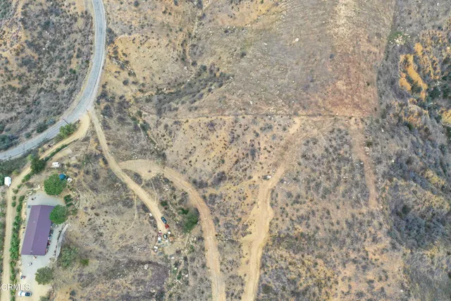 a view of mountain with yard