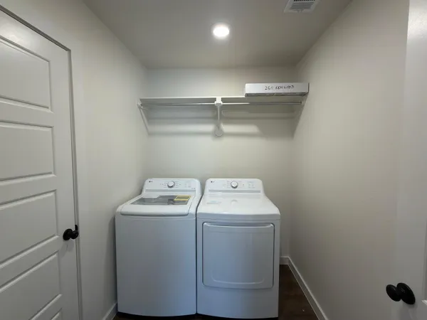 a utility room with dryer and washer