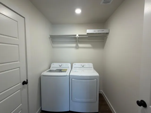 a utility room with dryer and washer