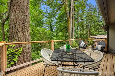 a view of a balcony with furniture