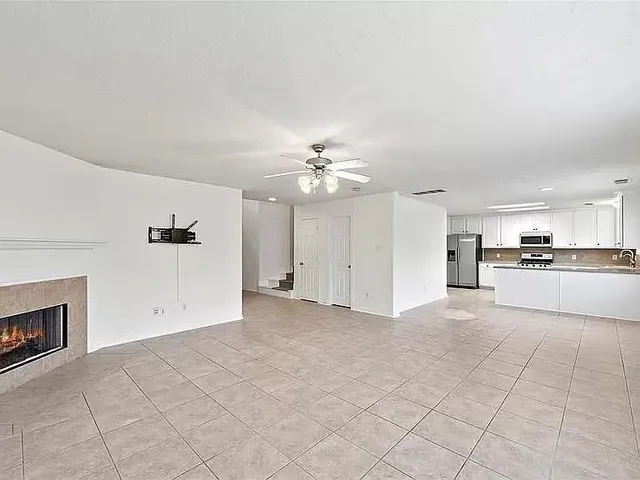 a view of a kitchen with a sink and a stove