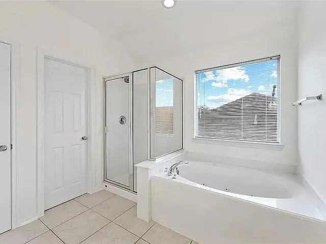 a view of a house with backyard and garden