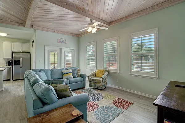 a living room with furniture and a rug
