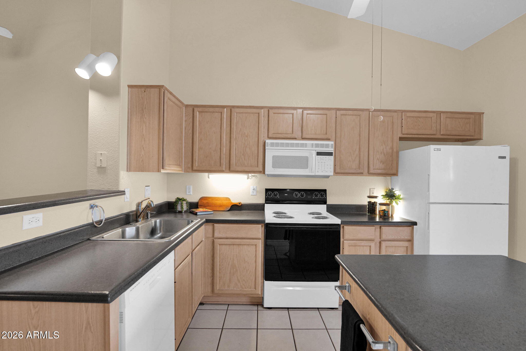 5808 East Brown Road, Unit 36 Mesa, AZ 85205 - Photo 14 of 29 a kitchen with a sink a stove a refrigerator and a sink