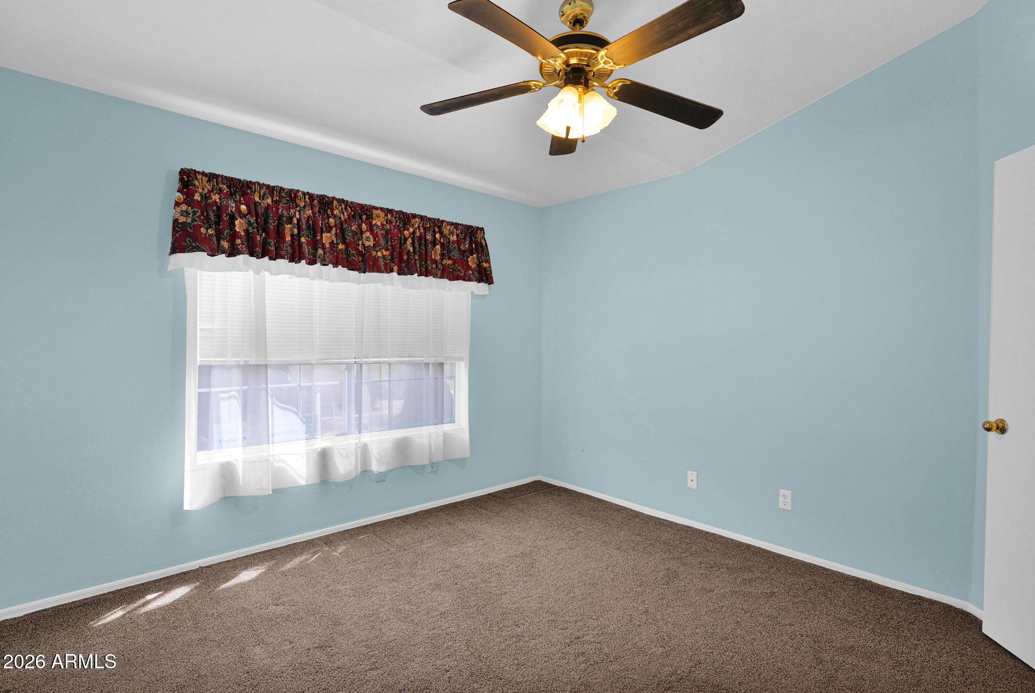 5808 East Brown Road, Unit 36 Mesa, AZ 85205 - Photo 21 of 29 an empty room with a window