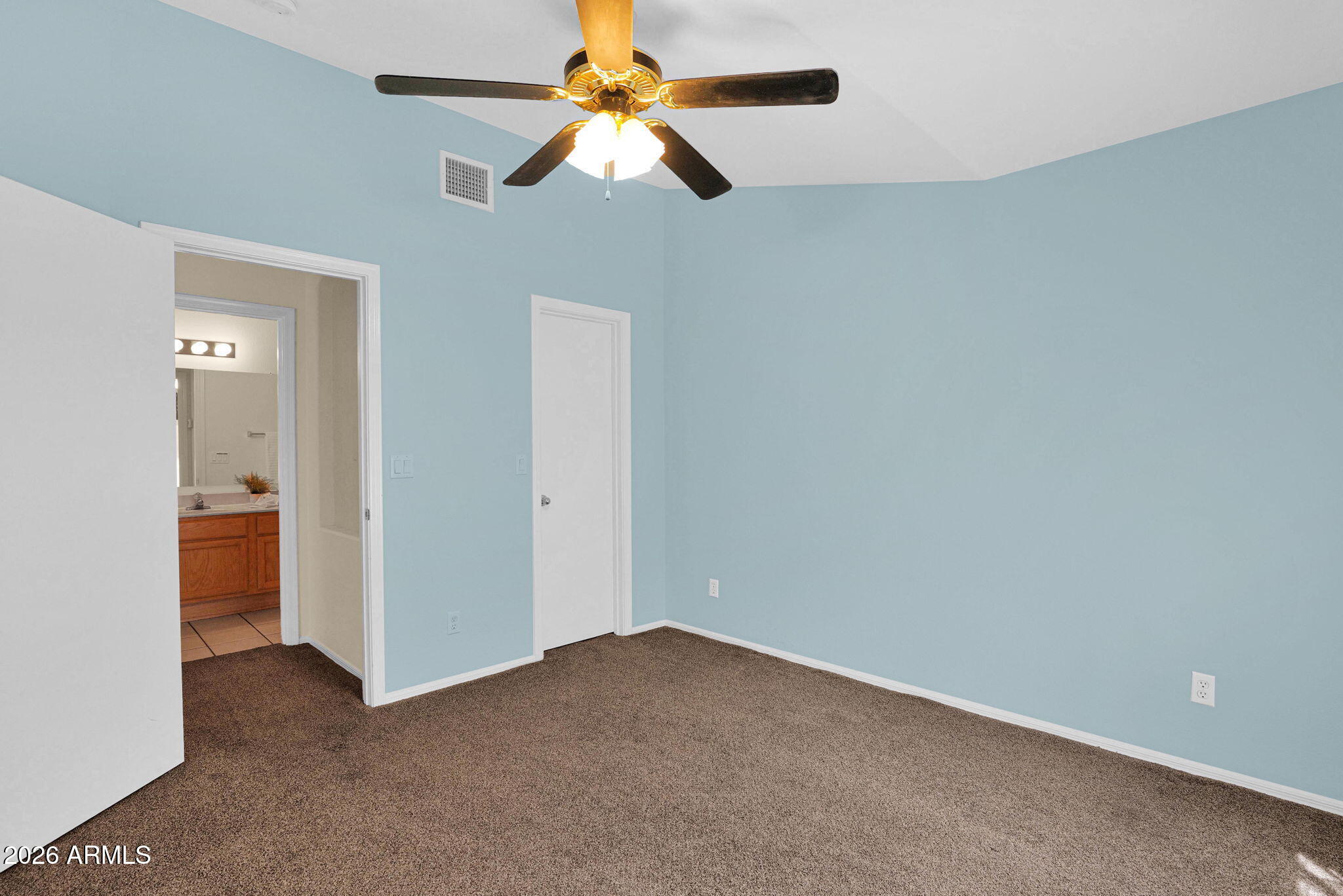 5808 East Brown Road, Unit 36 Mesa, AZ 85205 - Photo 22 of 29 an empty room with a fan and a fan