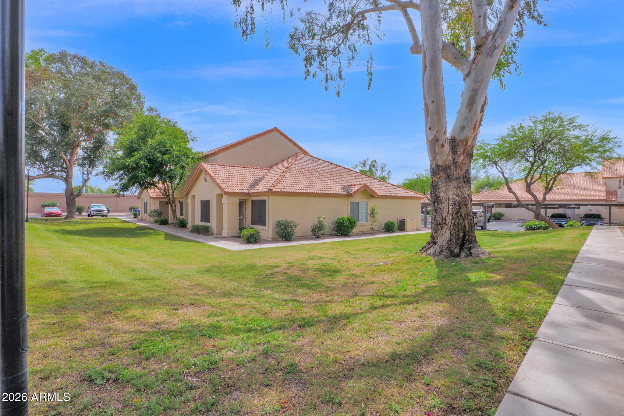 5808 East Brown Road, Unit 36 Mesa, AZ 85205 - Photo 26 of 29 a front view of a house with garden