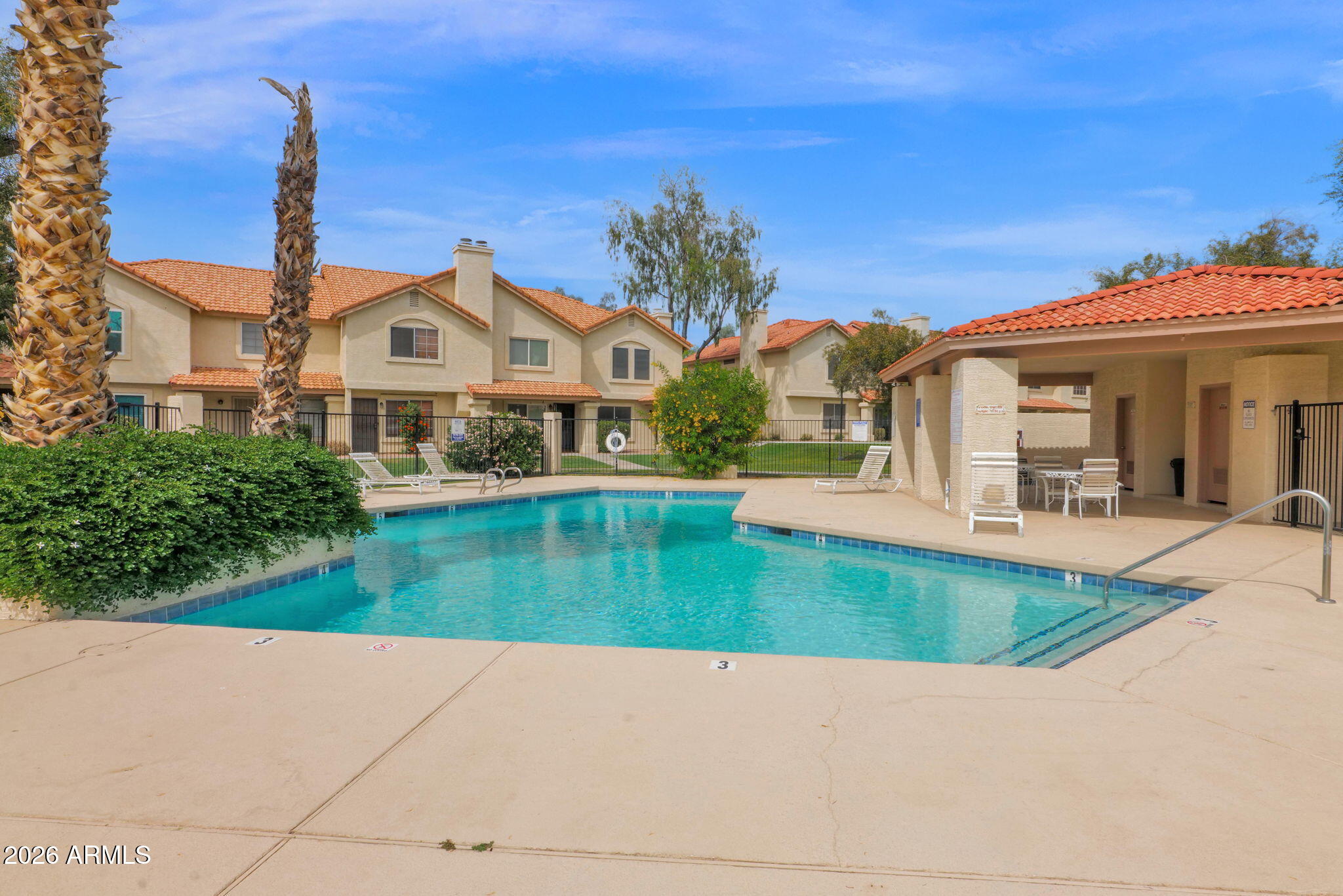 5808 East Brown Road, Unit 36 Mesa, AZ 85205 - Photo 2 of 29 a view of a house with a swimming pool