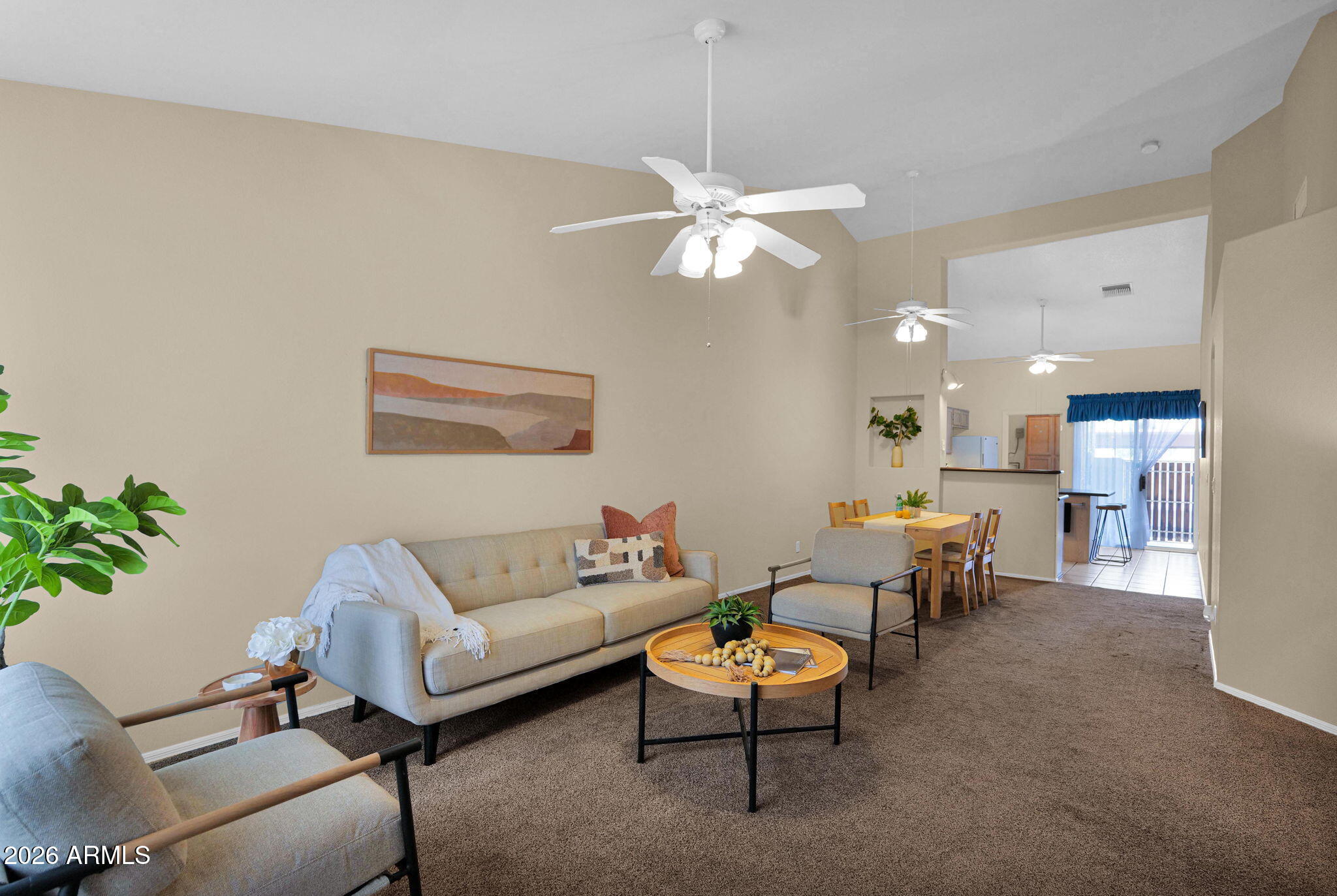 5808 East Brown Road, Unit 36 Mesa, AZ 85205 - Photo 6 of 29 a living room with furniture a chandelier and a potted plant