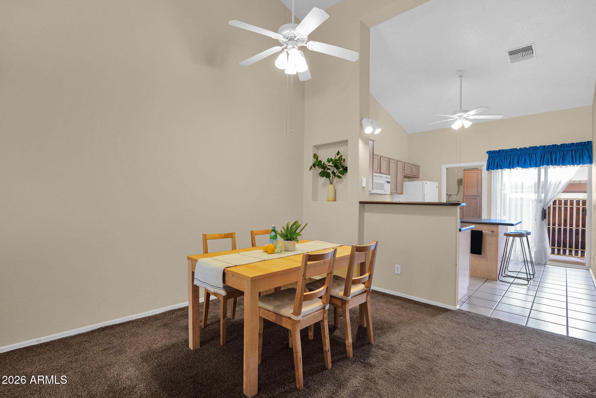5808 East Brown Road, Unit 36 Mesa, AZ 85205 - Photo 8 of 29 a dining room with furniture and window