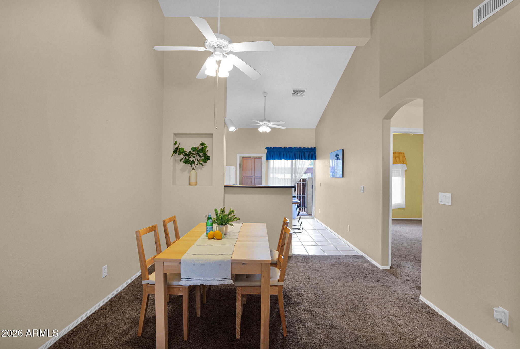 5808 East Brown Road, Unit 36 Mesa, AZ 85205 - Photo 9 of 29 a view of a dining room with furniture and chandelier