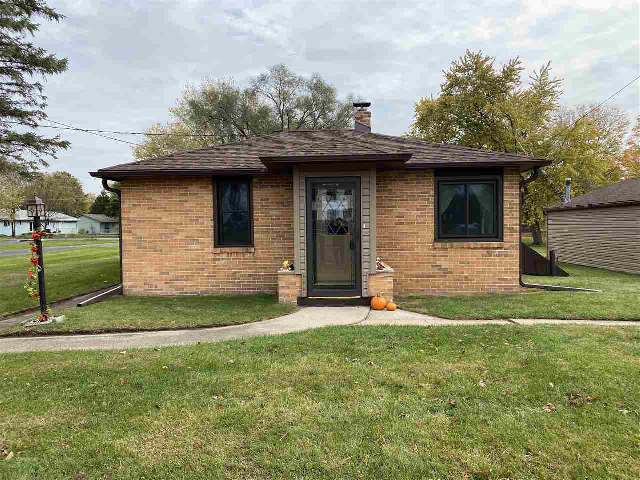 10979 2nd Street Roscoe, IL 61073 - Photo 1 of 30 a front view of a house with a yard