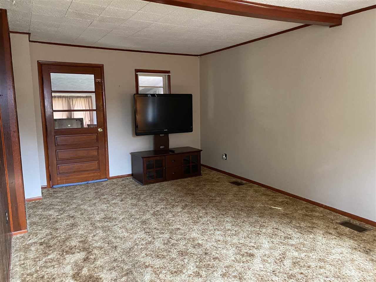 10979 2nd Street Roscoe, IL 61073 - Photo 19 of 30 a view of livingroom with furniture and flat screen tv