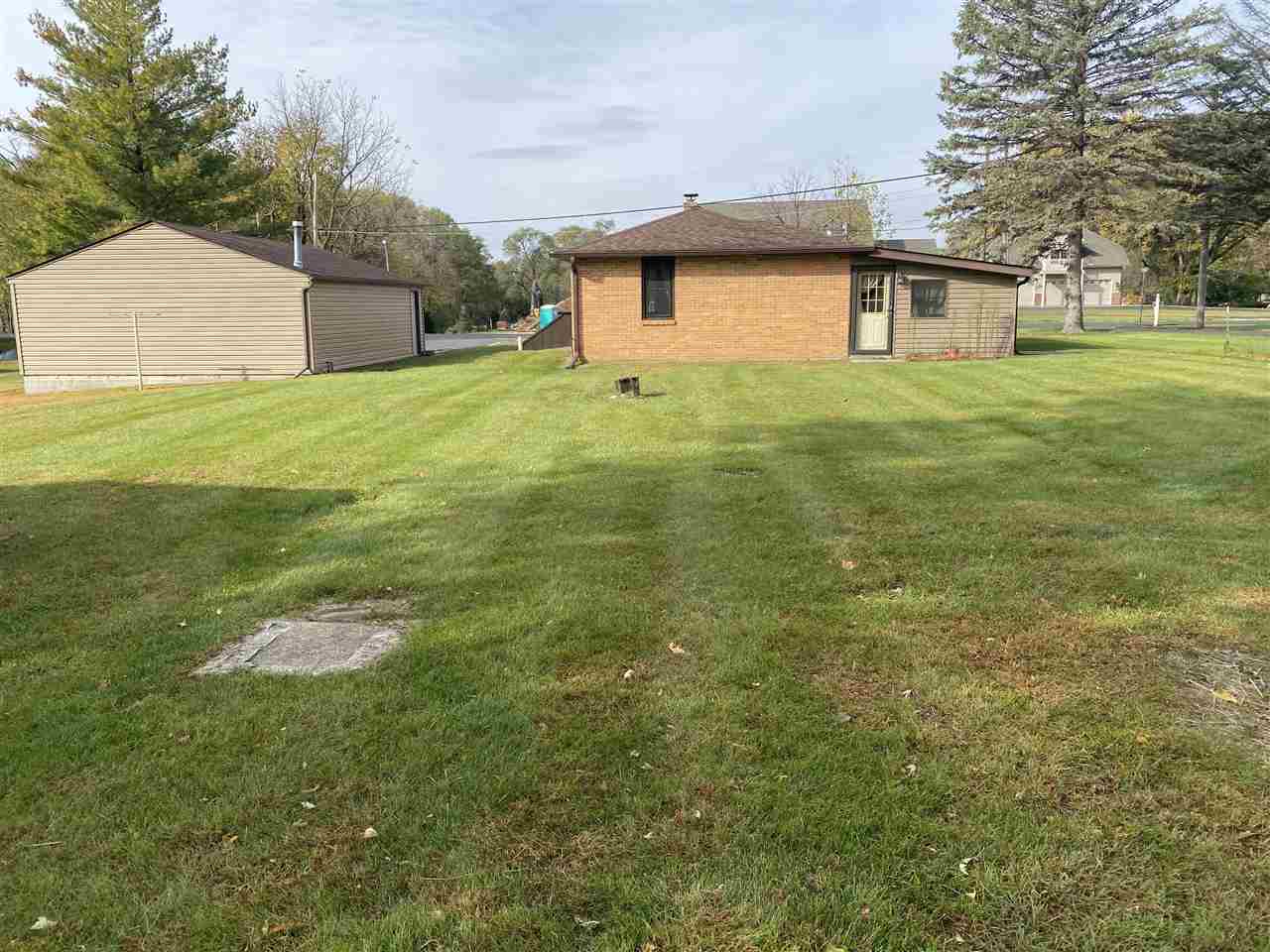 10979 2nd Street Roscoe, IL 61073 - Photo 27 of 30 a house that has garden in front of it