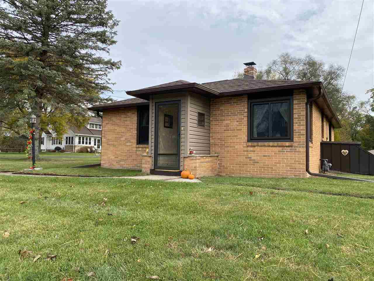10979 2nd Street Roscoe, IL 61073 - Photo 3 of 30 a view of a house with a yard