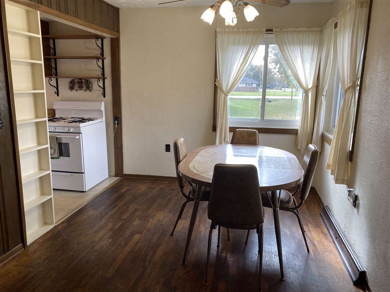 10979 2nd Street Roscoe, IL 61073 - Photo 7 of 30 a view of a dining room with furniture window and wooden floor