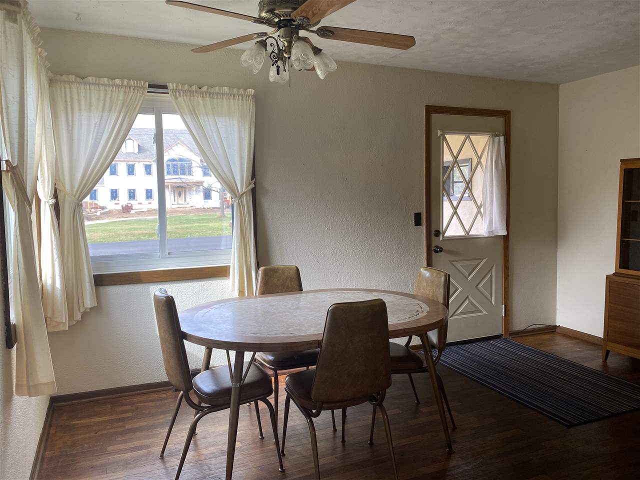 10979 2nd Street Roscoe, IL 61073 - Photo 8 of 30 a view of a dining room with furniture window and wooden floor