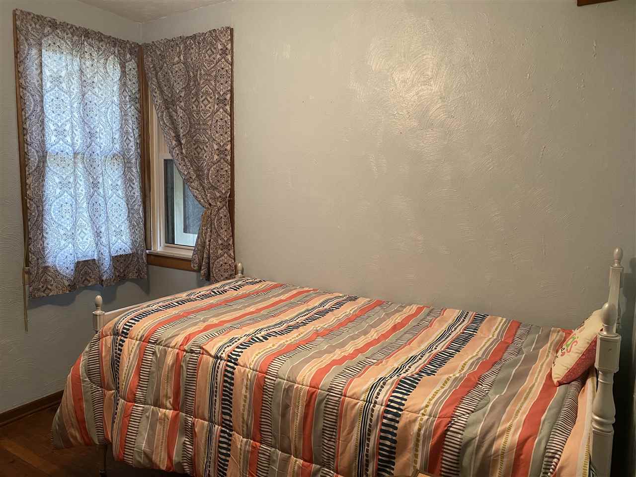 10979 2nd Street Roscoe, IL 61073 - Photo 9 of 30 a bedroom with a bed and a window