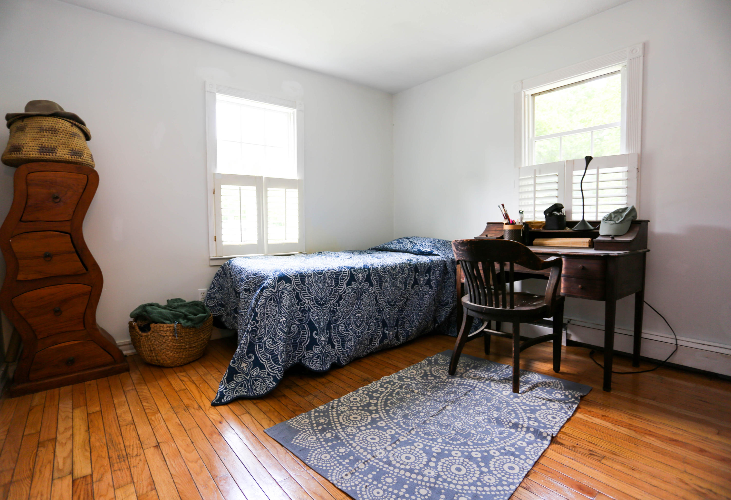 64 Crooked Pond Road Hyannis, MA 02601 - Photo 11 of 21 a bedroom with a bed and wooden floor