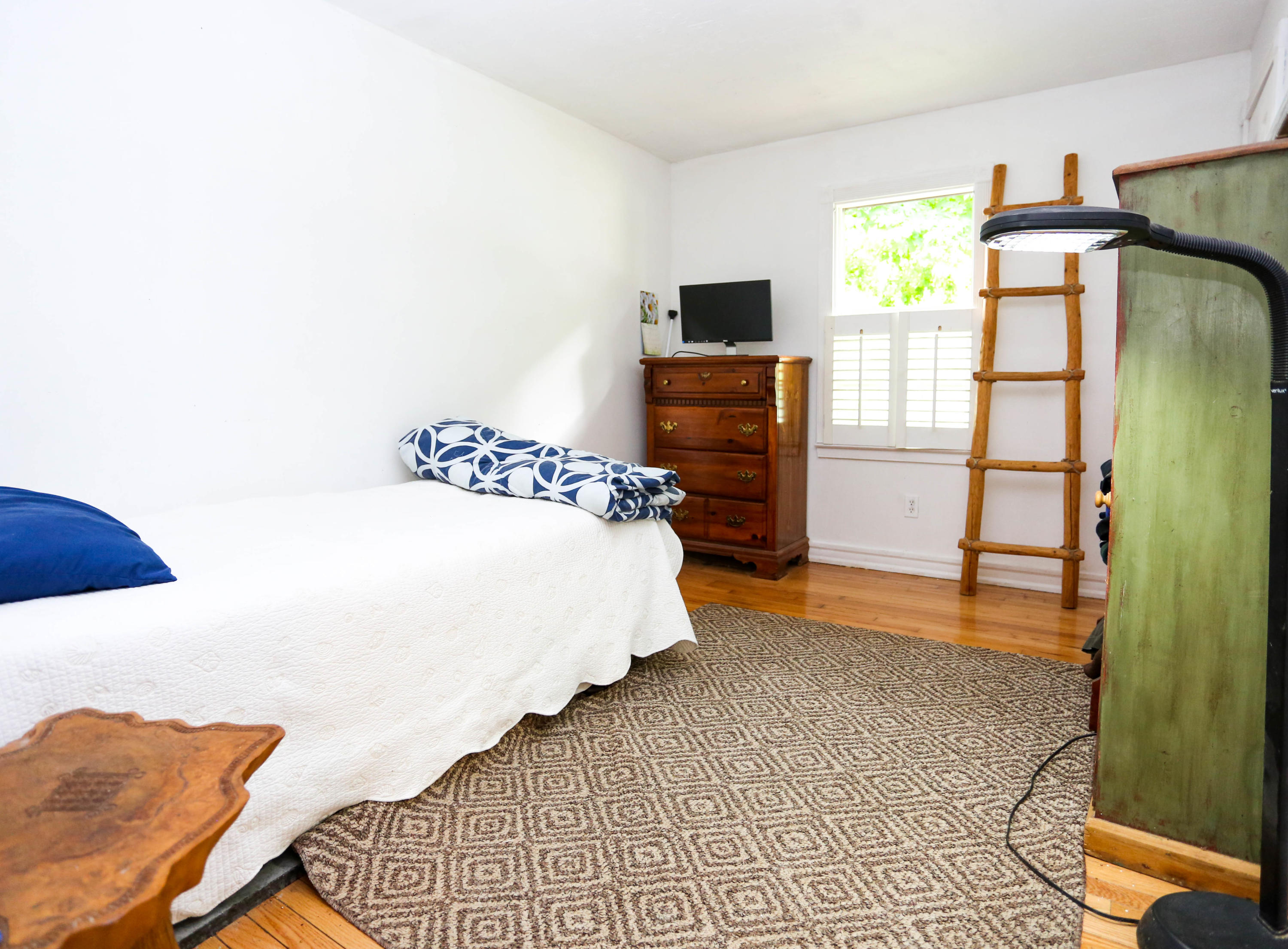 64 Crooked Pond Road Hyannis, MA 02601 - Photo 12 of 21 a bedroom with a bed and a tv on the dresser