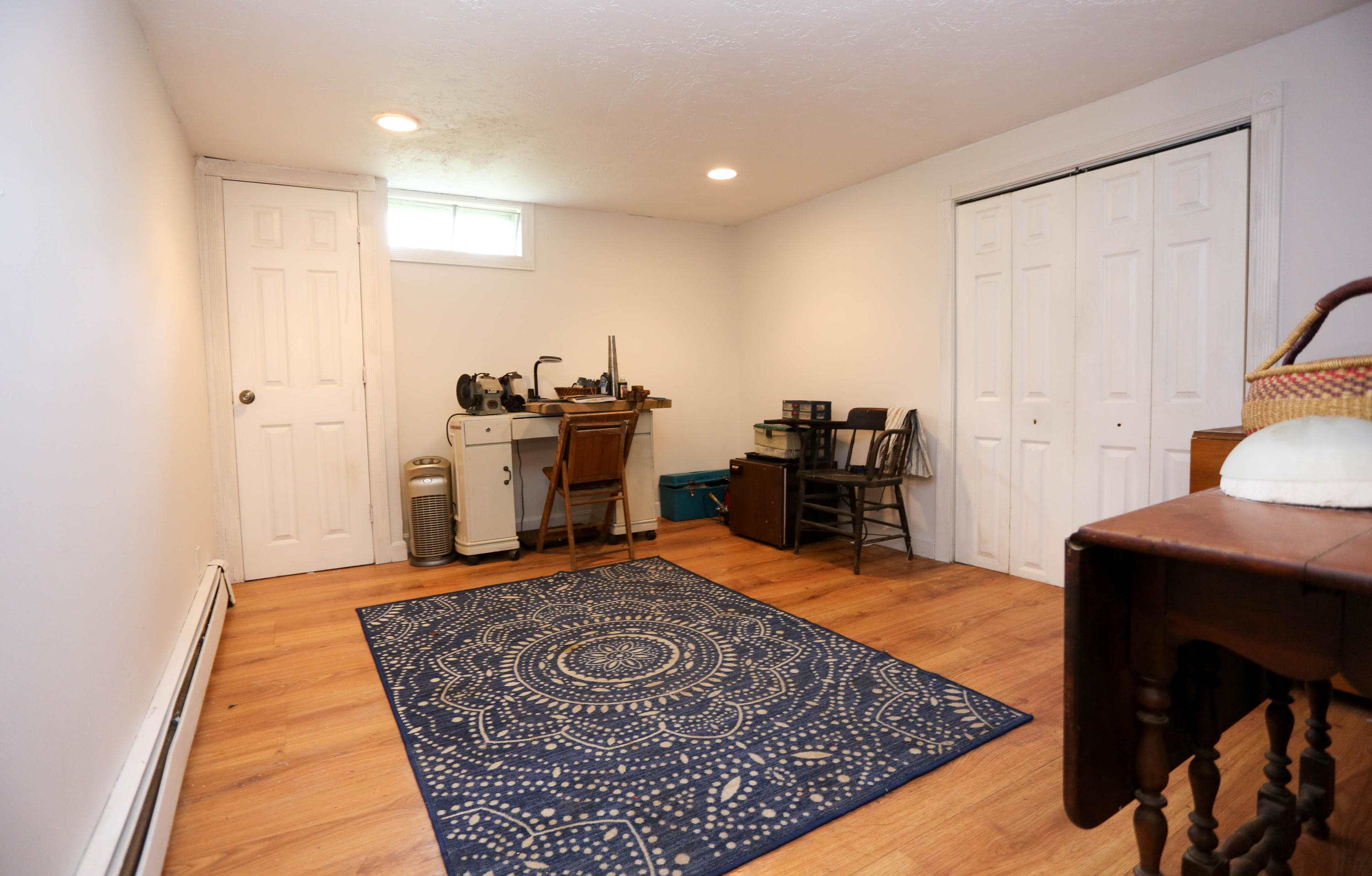 64 Crooked Pond Road Hyannis, MA 02601 - Photo 15 of 21 a living room with a rug and a dresser