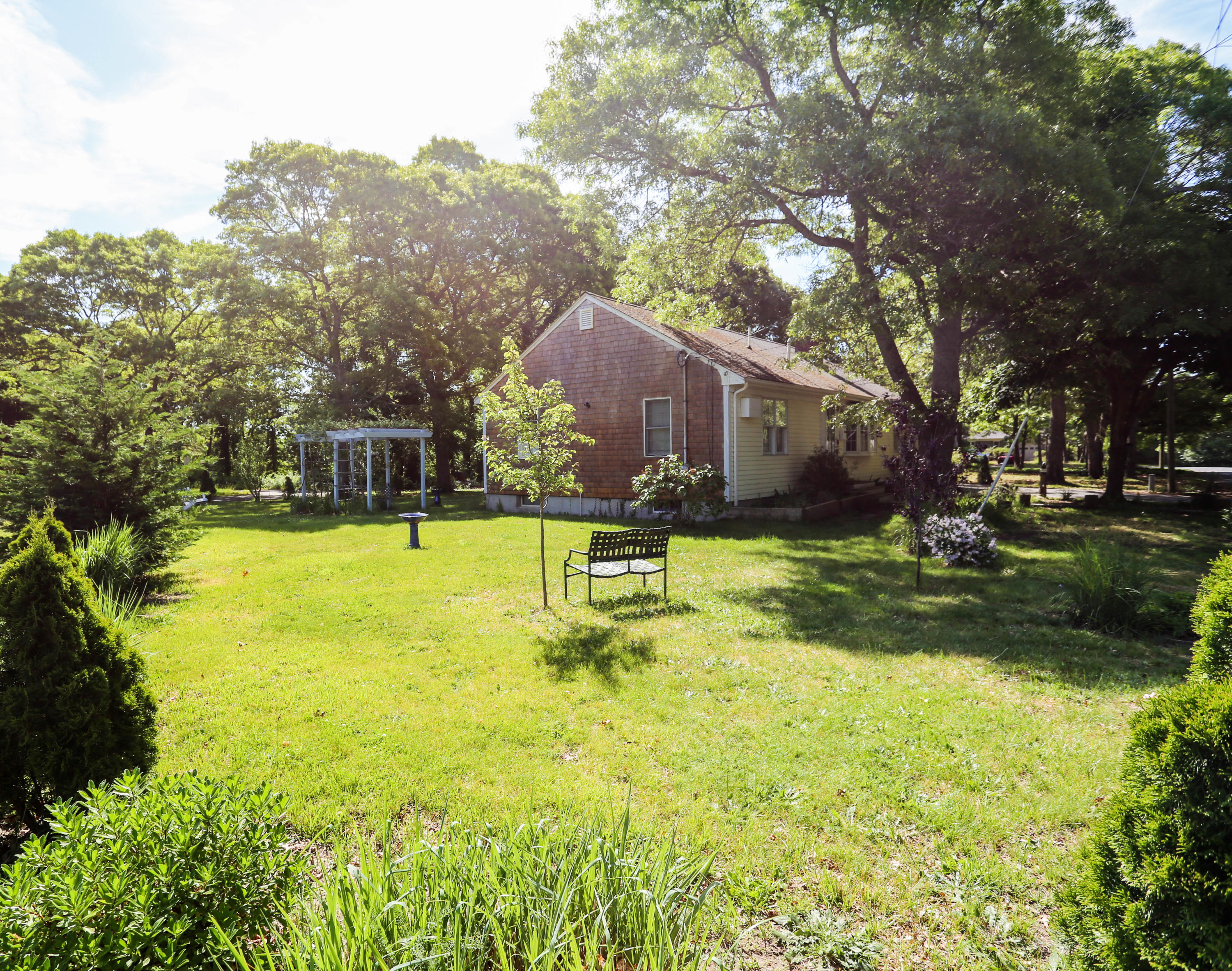 64 Crooked Pond Road Hyannis, MA 02601 - Photo 4 of 21 a swimming pool with outdoor seating and yard