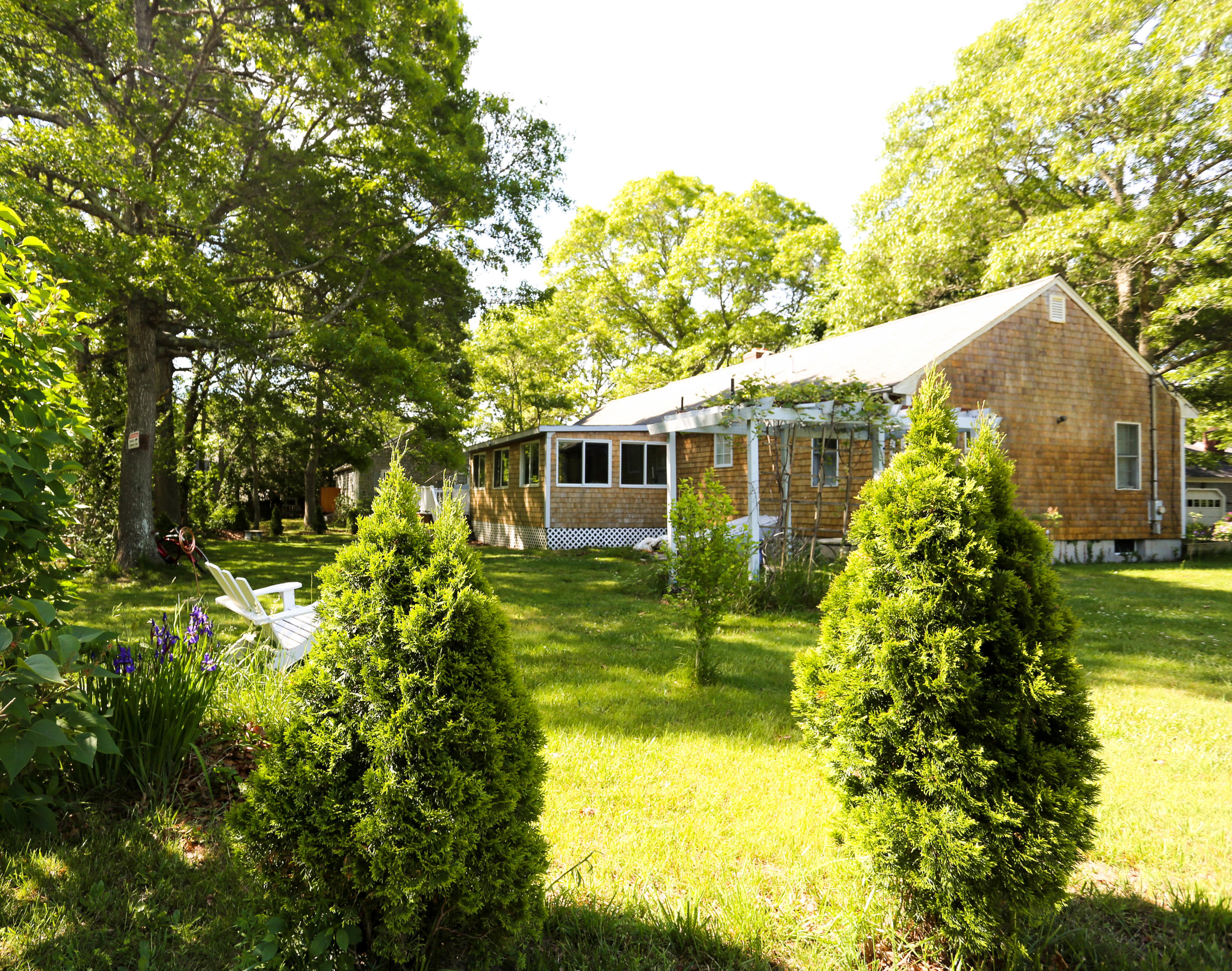 64 Crooked Pond Road Hyannis, MA 02601 - Photo 5 of 21 a view of a house with a garden
