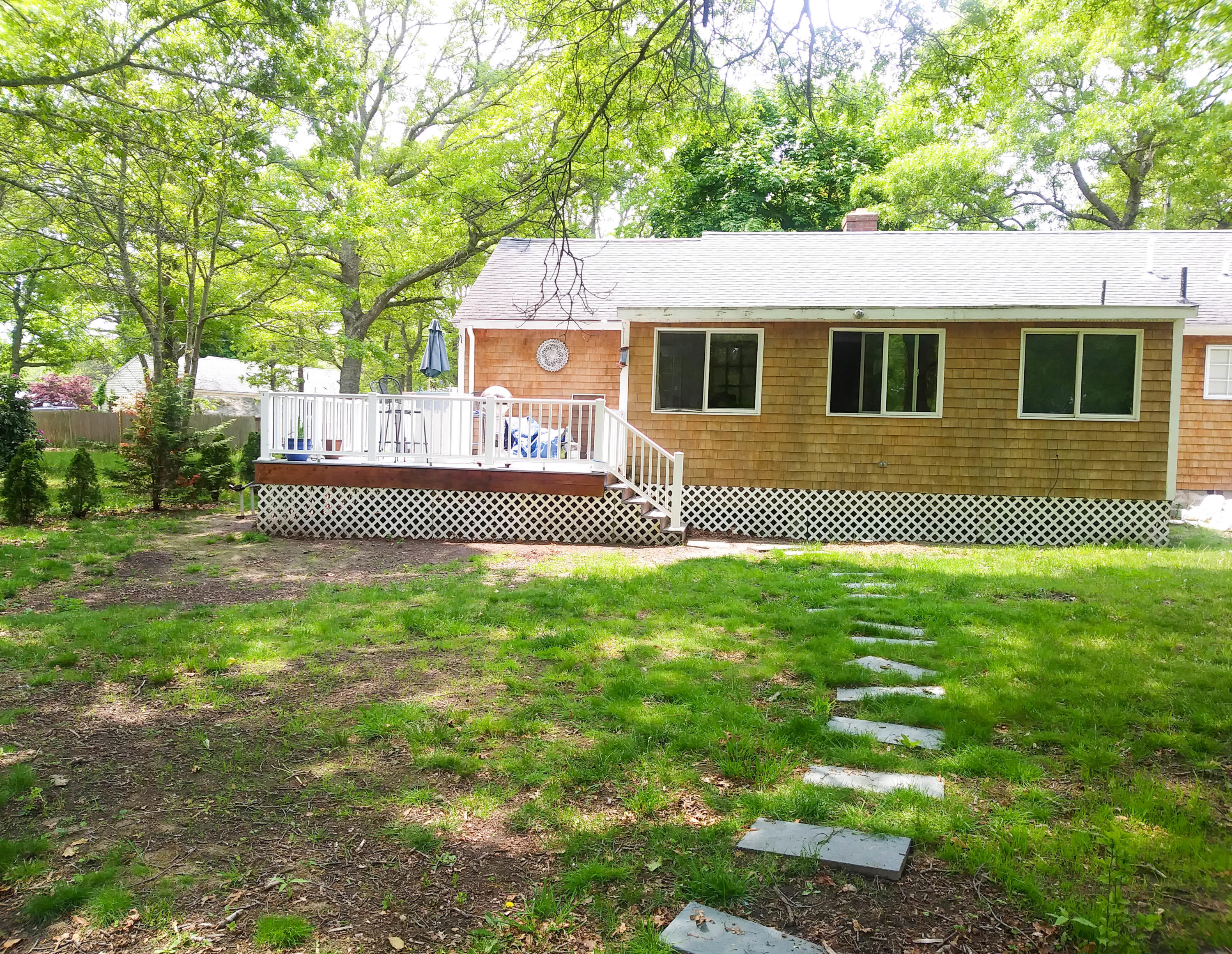 64 Crooked Pond Road Hyannis, MA 02601 - Photo 6 of 21 a house view with a garden space