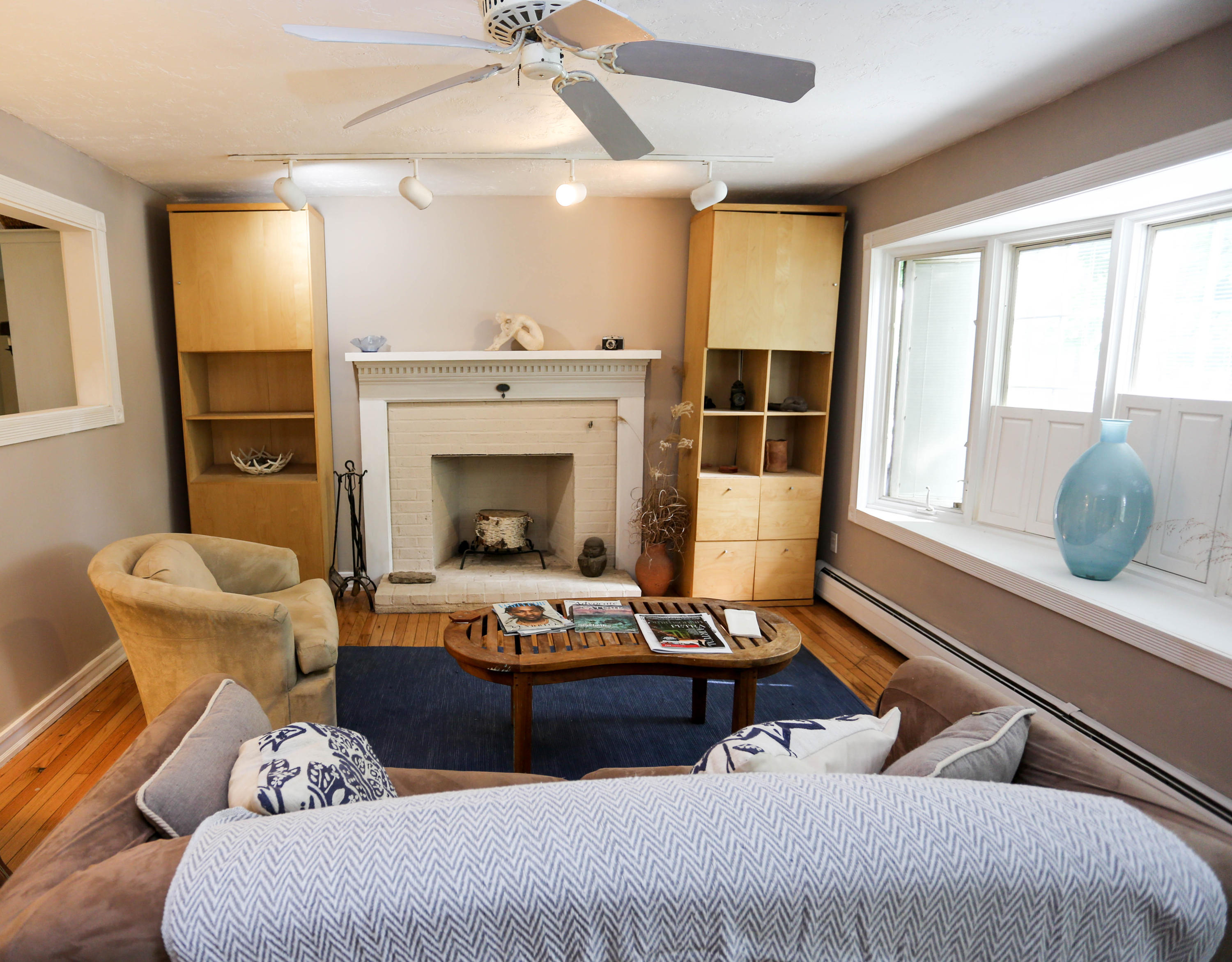64 Crooked Pond Road Hyannis, MA 02601 - Photo 7 of 21 a living room with furniture and a fireplace