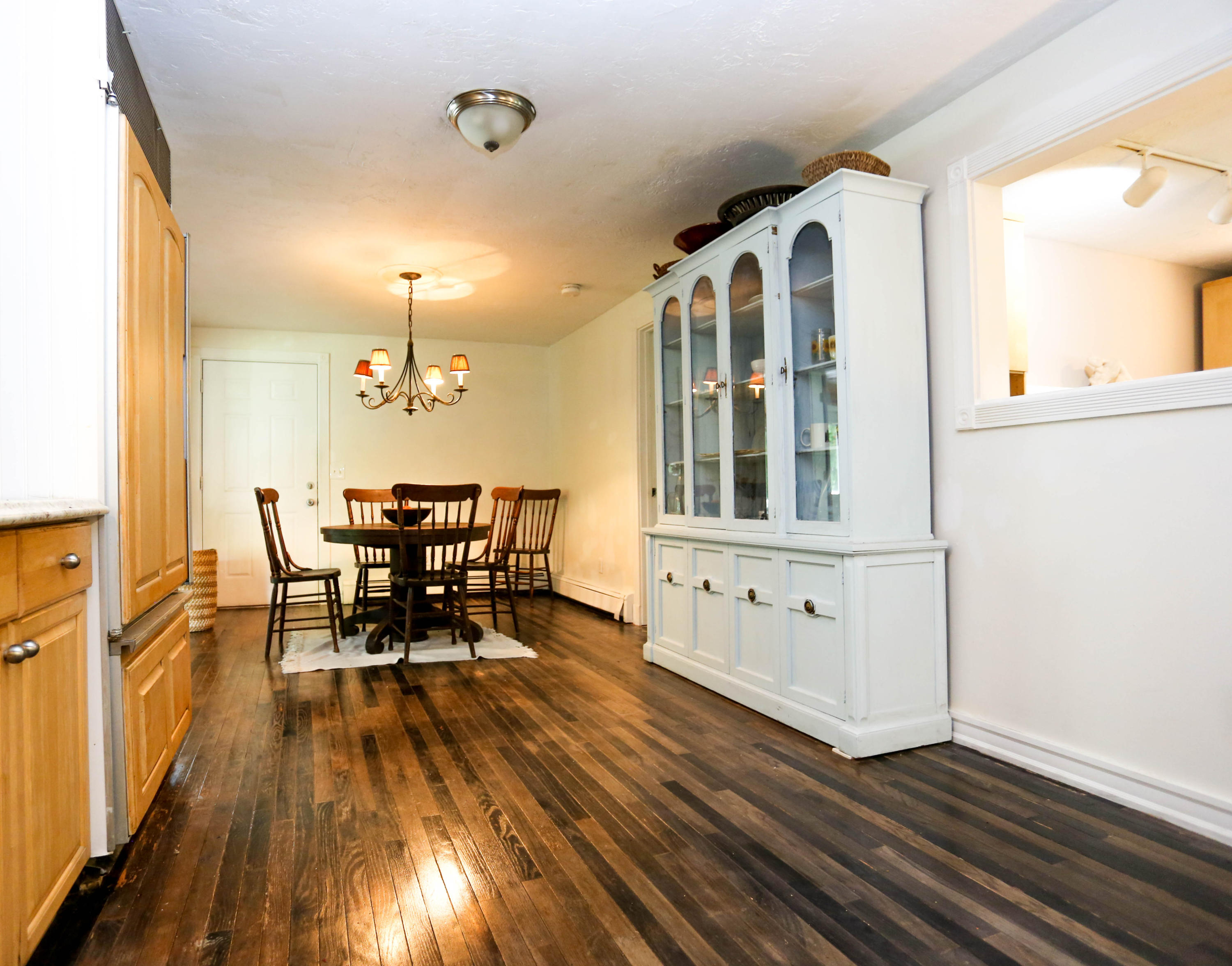 64 Crooked Pond Road Hyannis, MA 02601 - Photo 8 of 21 a view of a dining room with furniture and wooden floor