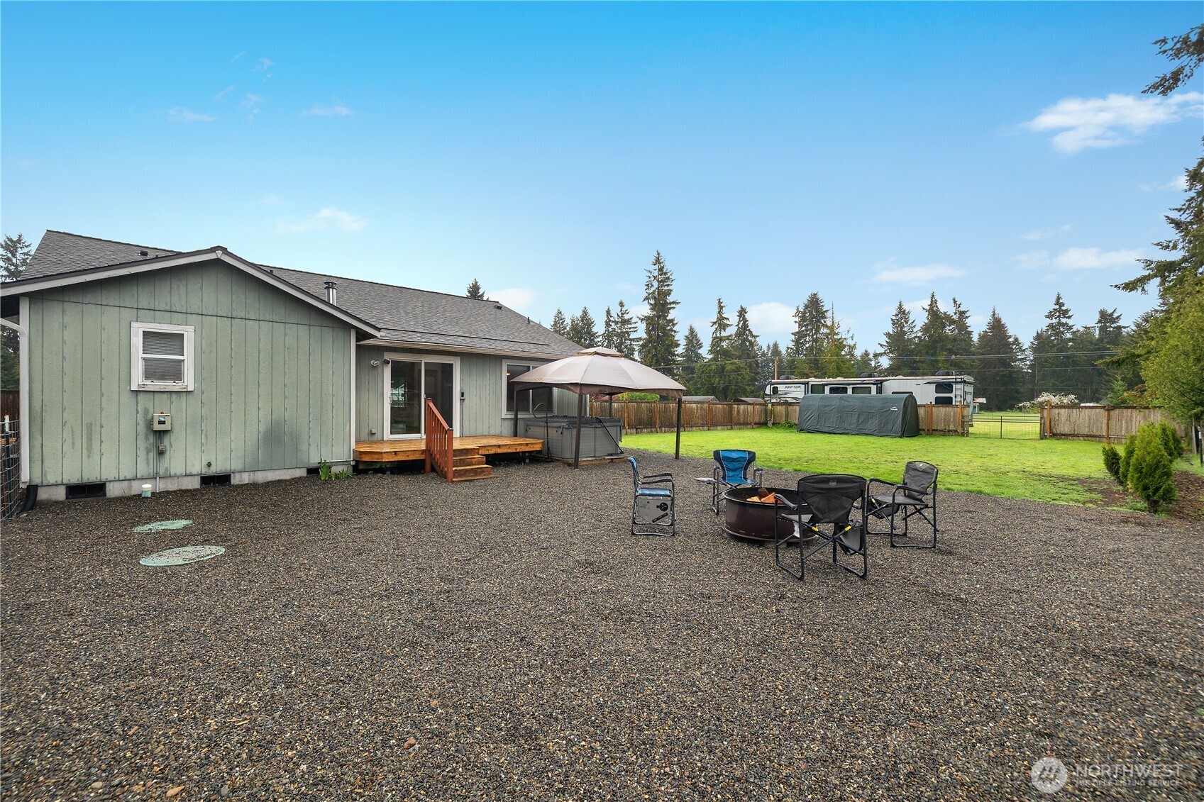 7606 187th Avenue Southwest Rochester, WA 98579 - Photo 25 of 28 a view of a house with a yard and sitting area