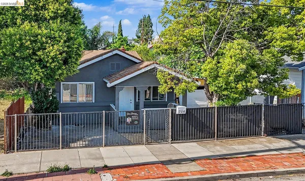 a house view with a wooden fence