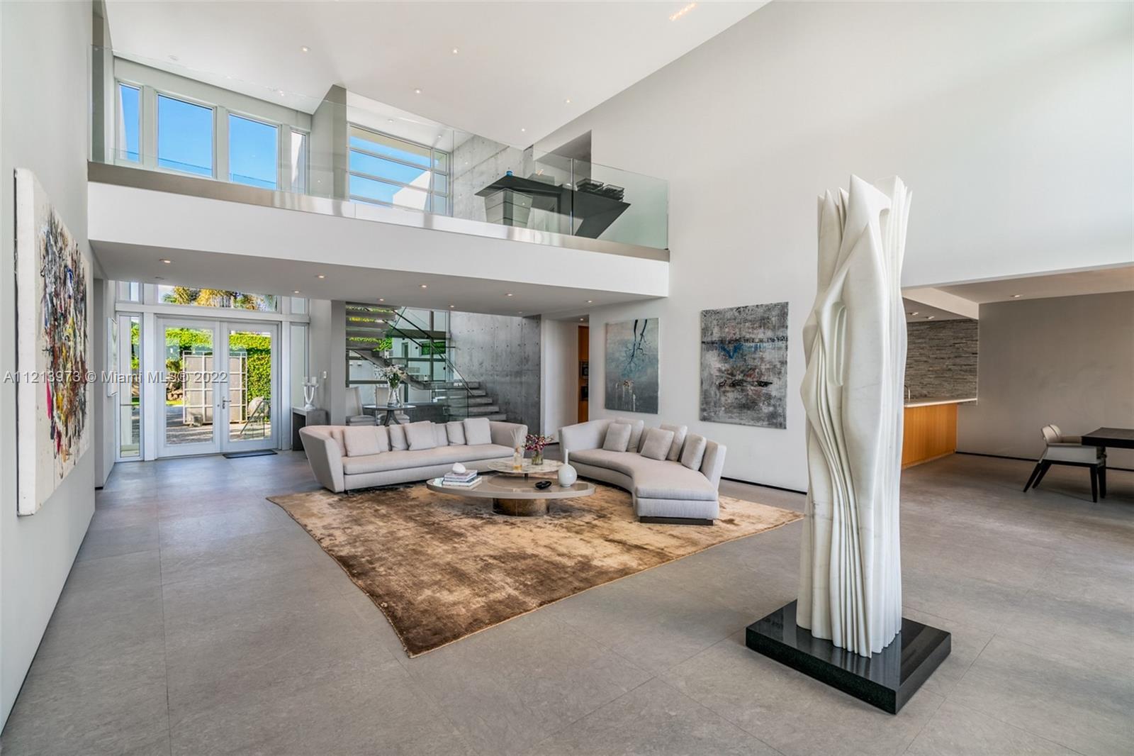 1236 Biscaya Drive Surfside, FL 33154 - Photo 11 of 40 a living room with fireplace furniture and a floor to ceiling window