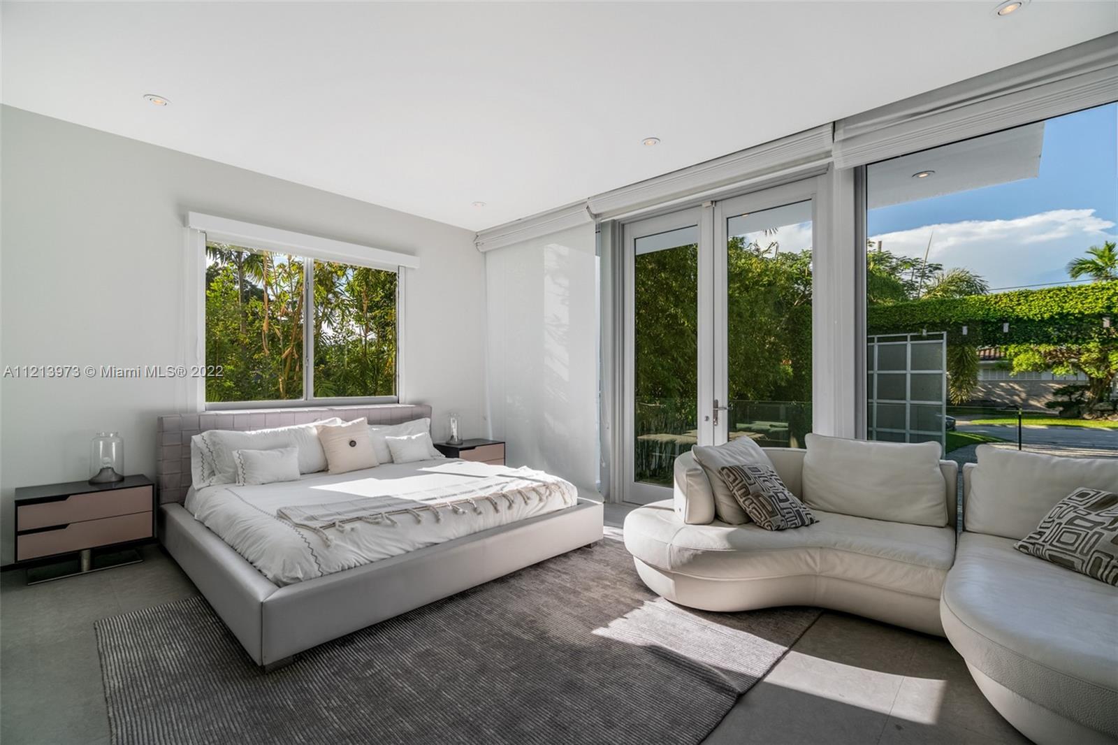 1236 Biscaya Drive Surfside, FL 33154 - Photo 17 of 40 a living room with furniture and a large window