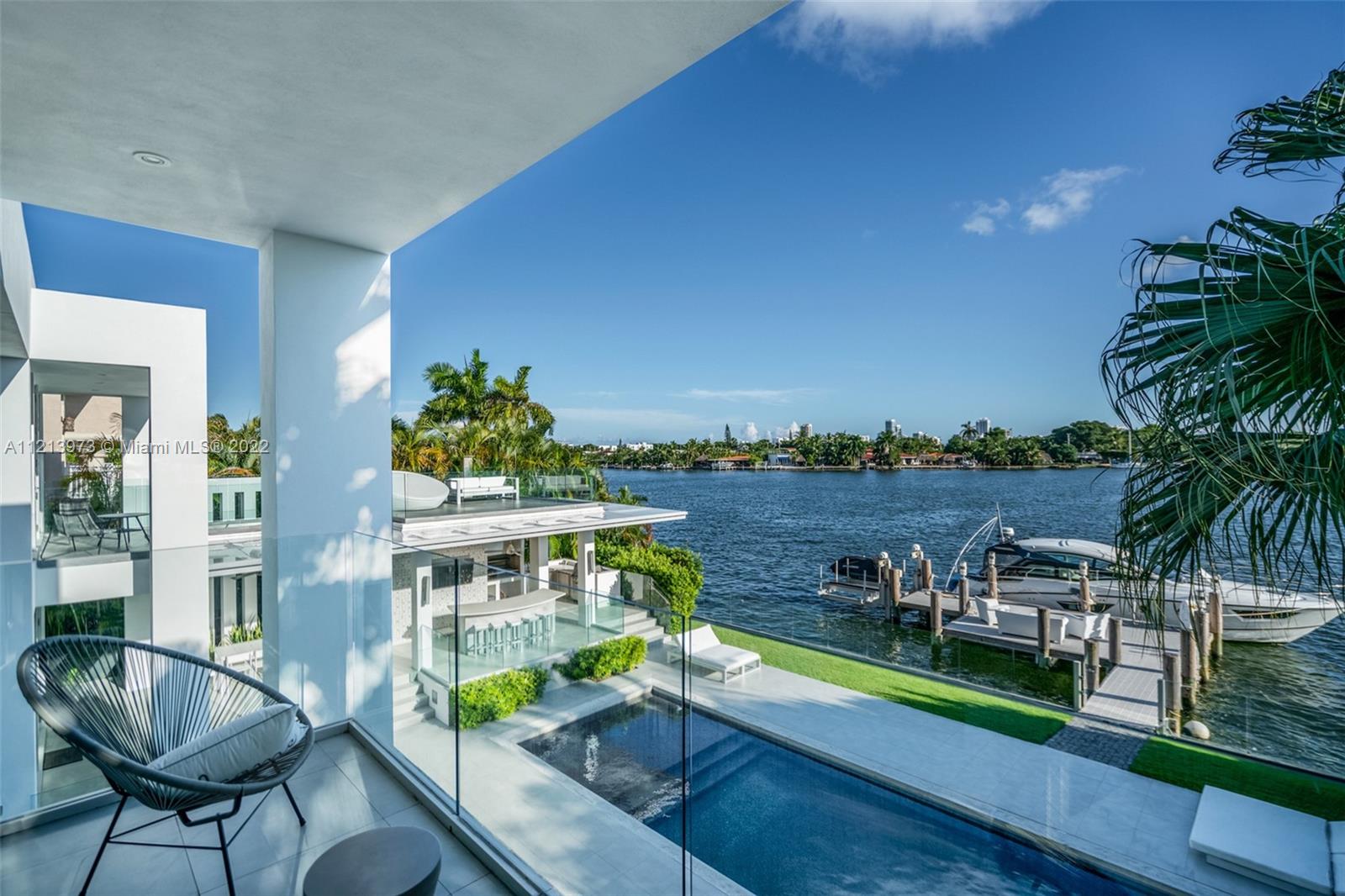 1236 Biscaya Drive Surfside, FL 33154 - Photo 19 of 40 a view of a chairs and table in patio