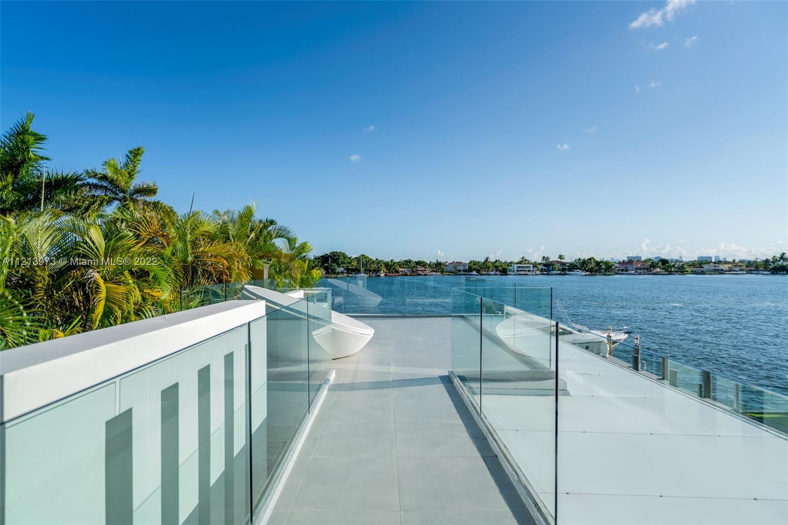 1236 Biscaya Drive Surfside, FL 33154 - Photo 35 of 40 a view of a lake from a balcony