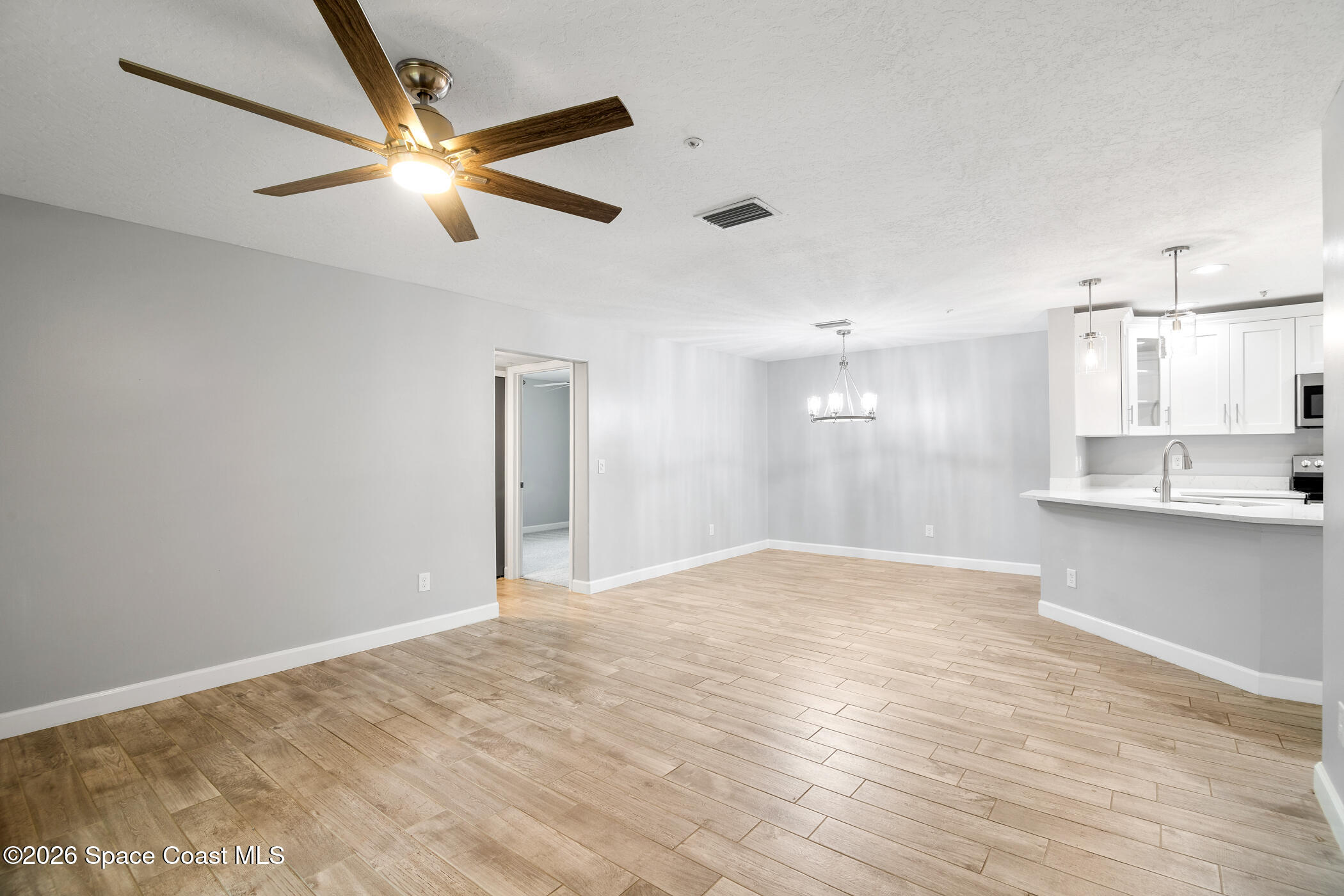 7667 North Wickham Road, Unit 1201 Melbourne, FL 32940 - Photo 2 of 29 Entryway Living/Dining Combo