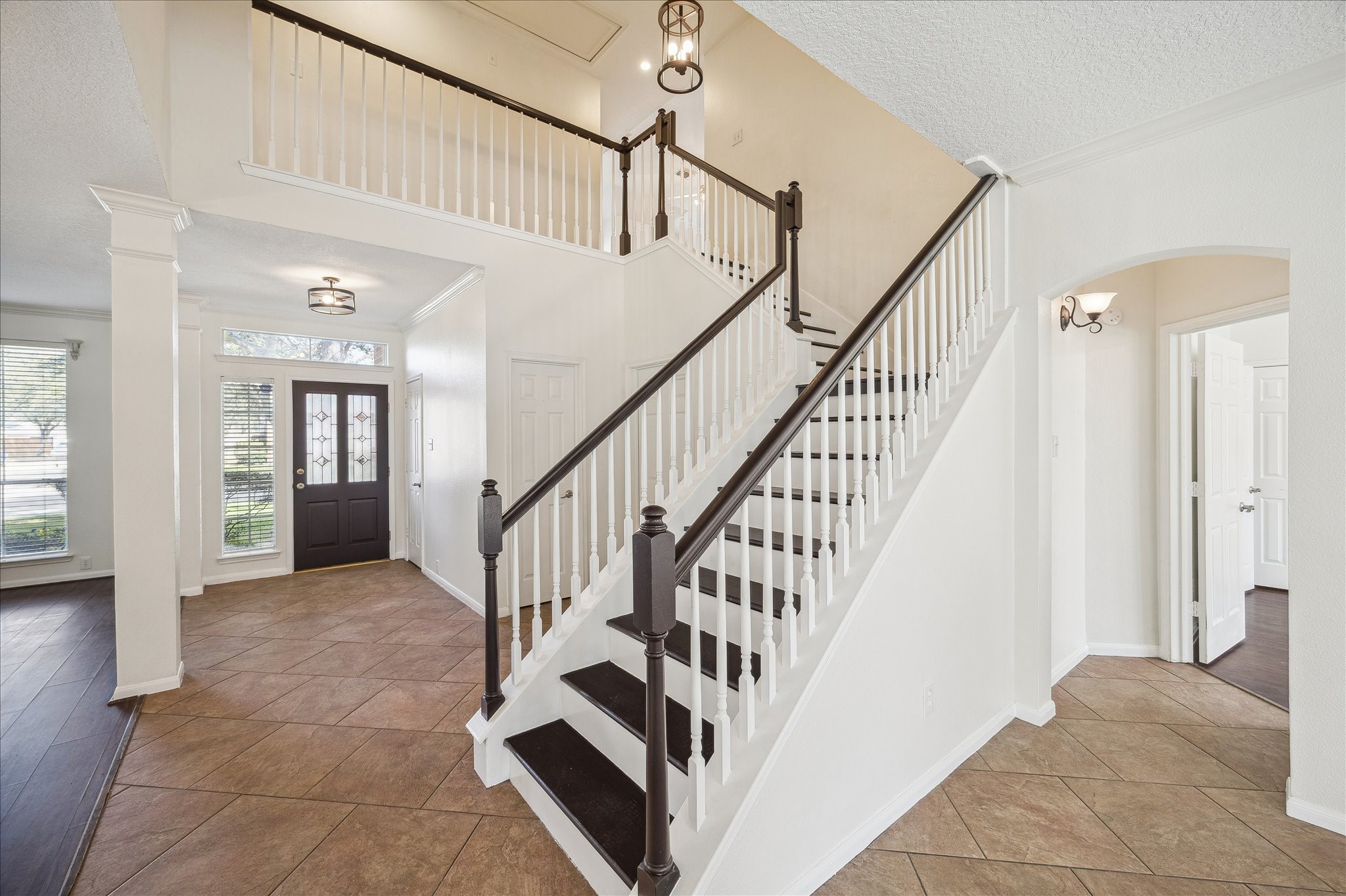 12831 Dove Point Lane Houston, TX 77041 - Photo 7 of 50 a view of staircase with white walls and a next to a window