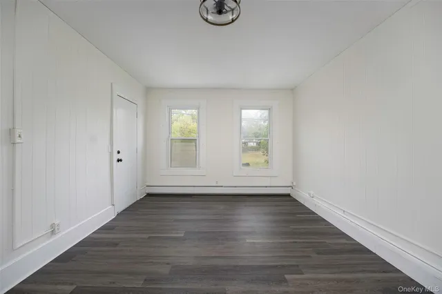 a bathroom with a toilet and a bathtub