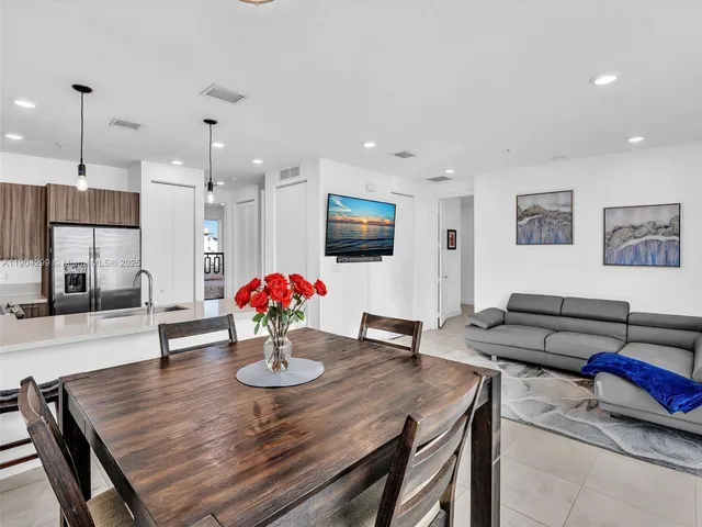 a view of a dining room and livingroom with furniture