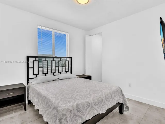 a bathroom with a sink a bathtub and a mirror