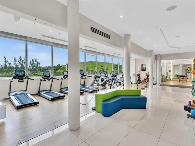 a view of a chairs and table in a backyard
