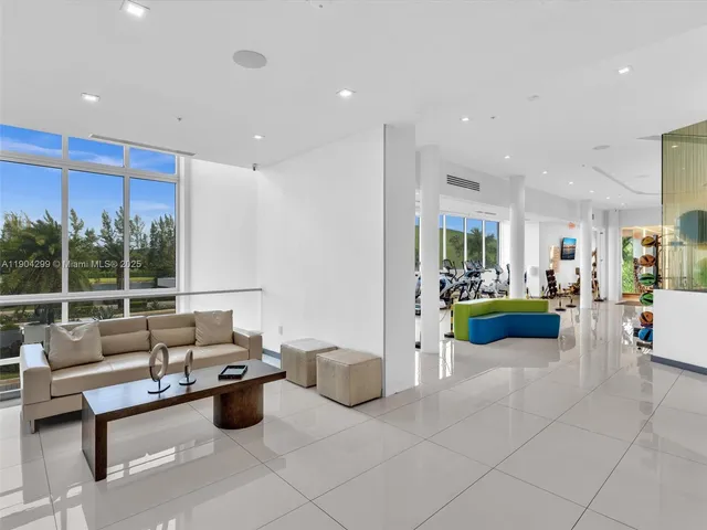 a patio with a table and chairs under an umbrella