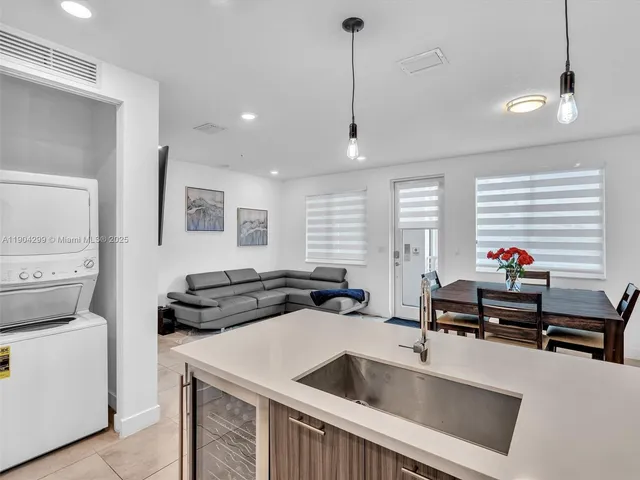 a view of a dining room with furniture and window