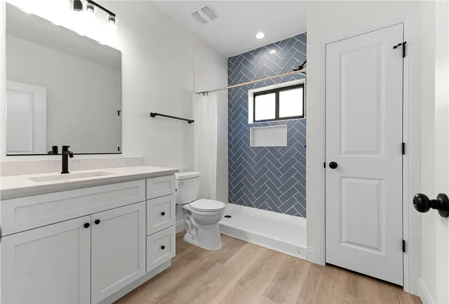 a bathroom with a toilet a sink and a bathtub