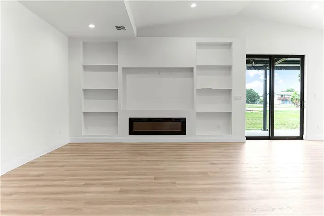 a kitchen with a white cabinets and a stove
