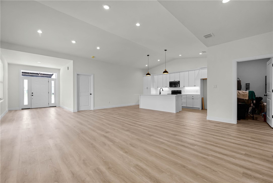 1210 West Dallas Seadrift, TX 77983 - Photo 2 of 21 a view of kitchen with a sink wooden cabinets and window