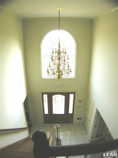 532 Roberts Road Nazareth, PA 18064 - Photo 12 of 34 a view of a hallway with furniture and a chandelier